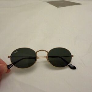 Ray-Ban Oval Gold Frame Sunglasses with Dark Green Lenses